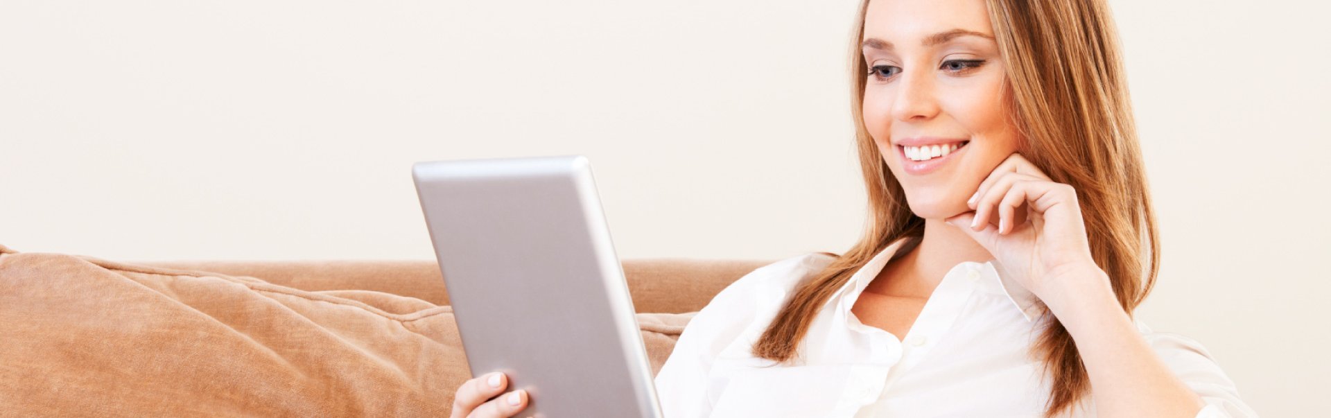 Woman On Her Tablet Browsing Summit Flooring's Website